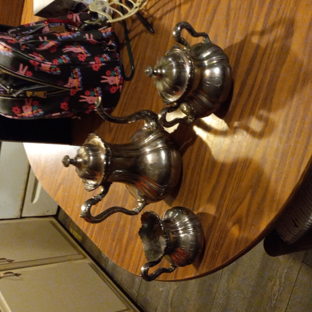 SILVER TEAPOT,CREAMER,AN SUGAR CONTAINER MADE BY MERIDEN B COMPANY
